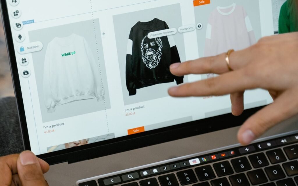Shopper browsing an online store category page on a laptop, the layer eCommerce SEO has to win