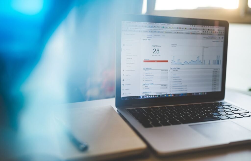 Analytics dashboard open on a laptop showing organic landing page performance
