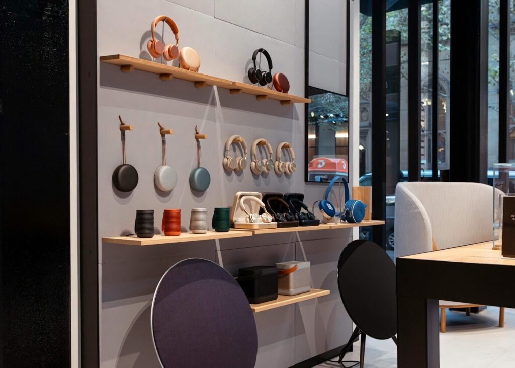 A retail display of headphones, audio devices and a speaker
