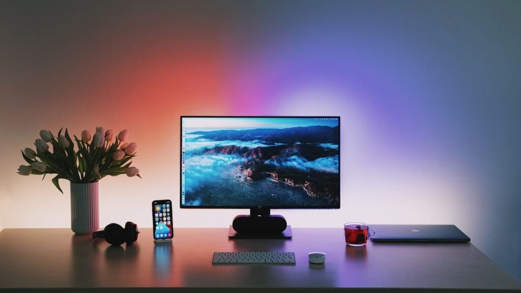 A flat screen monitor on a wooden desk
