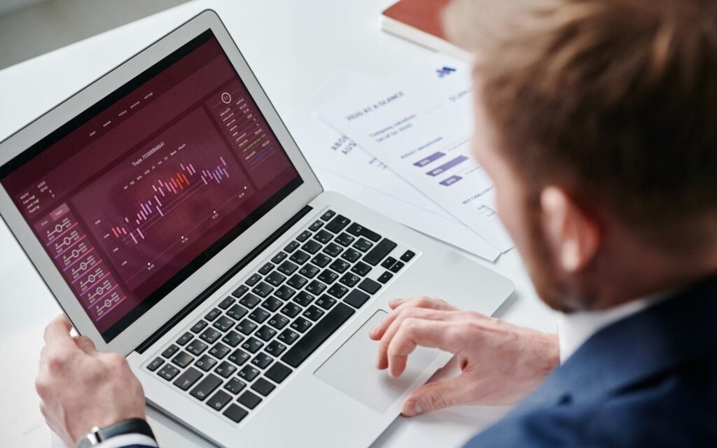 Marketer reviewing an eCommerce paid advertising performance dashboard on a laptop