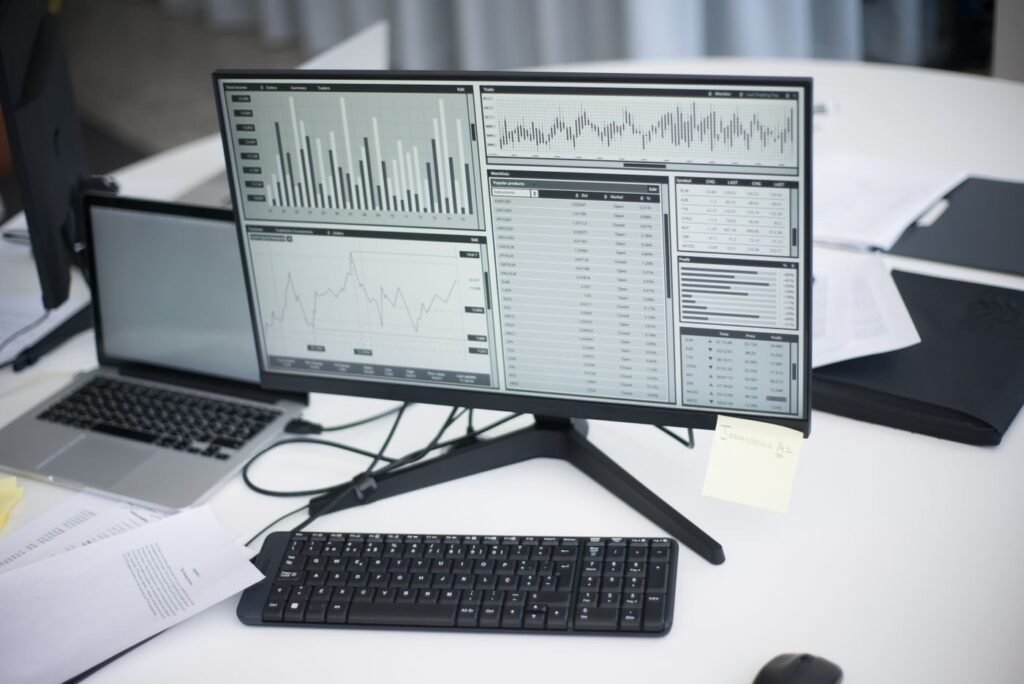 Workspace with computers showing eCommerce performance graphs