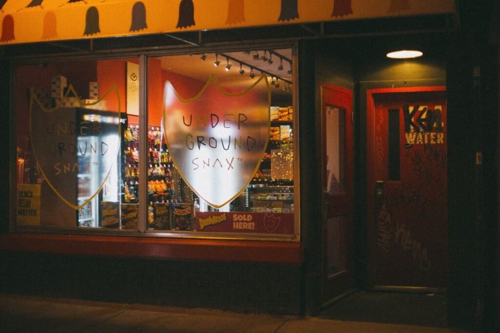 European city shop lit at night