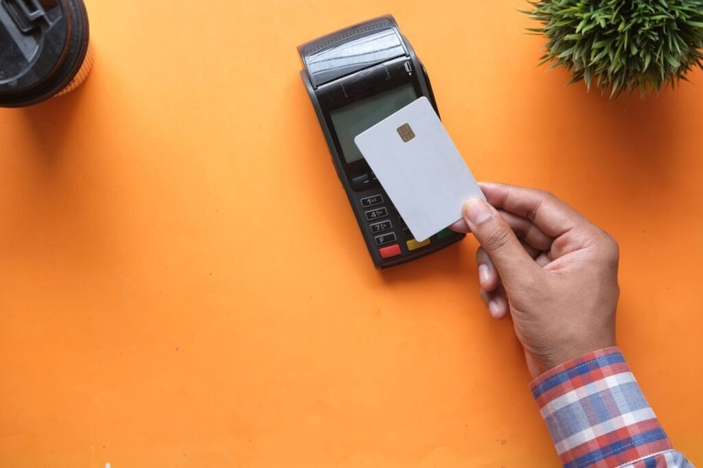Customer making a contactless card payment with a card reader