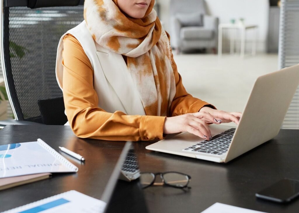 Professional working on a laptop preparing Arabic language content