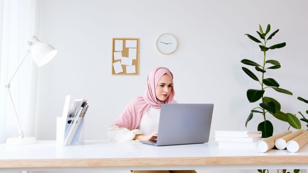 Shopper comparing products on a laptop at a desk