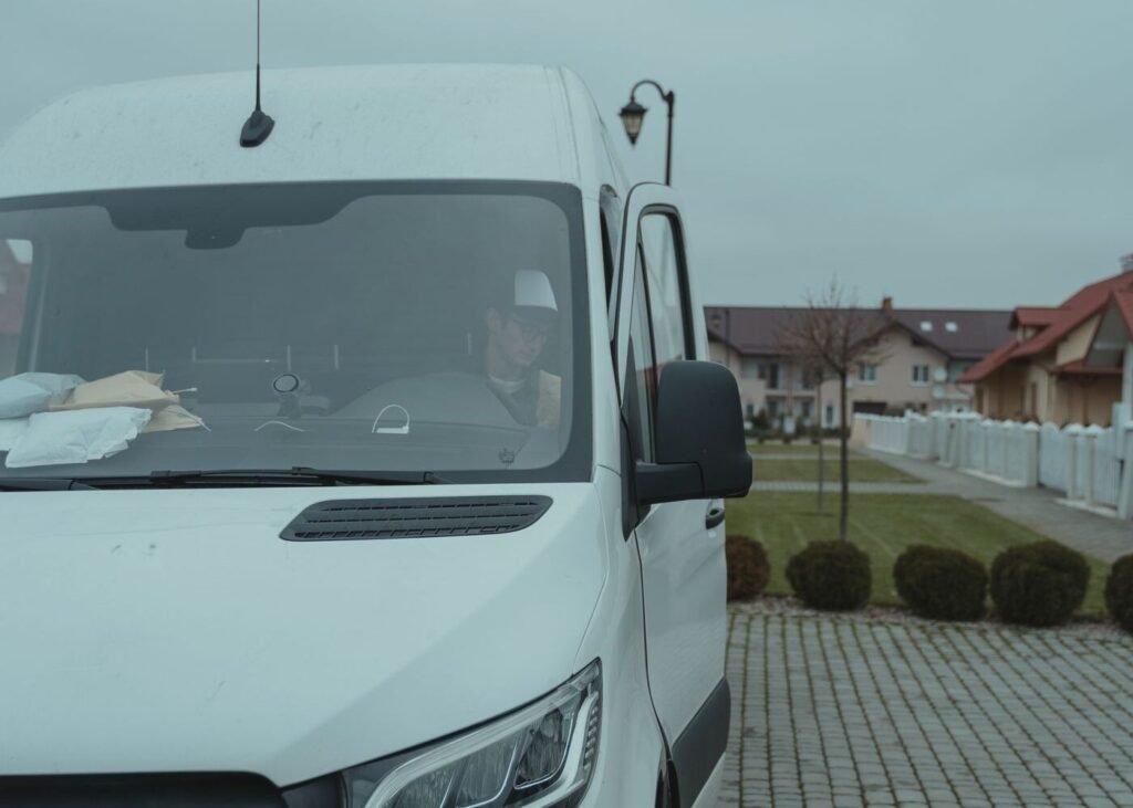 Delivery driver inside a courier van