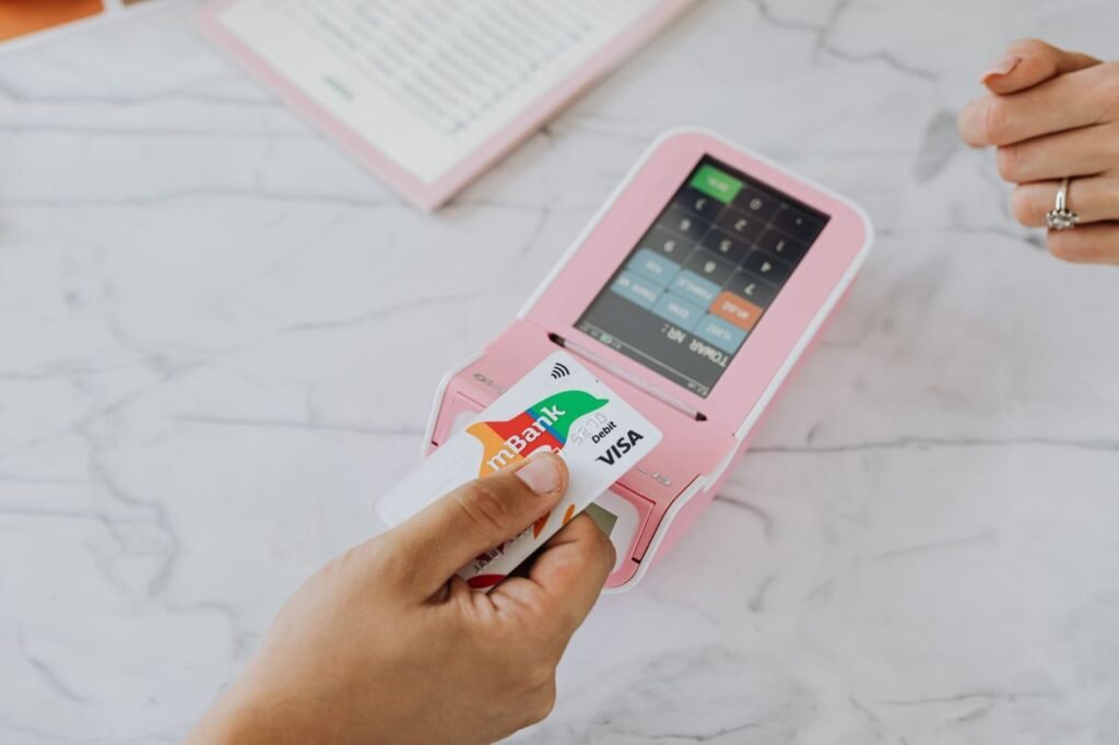 Customer making a contactless card payment on a terminal