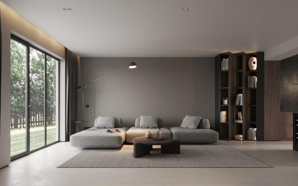 A modern living room furnished around a large window