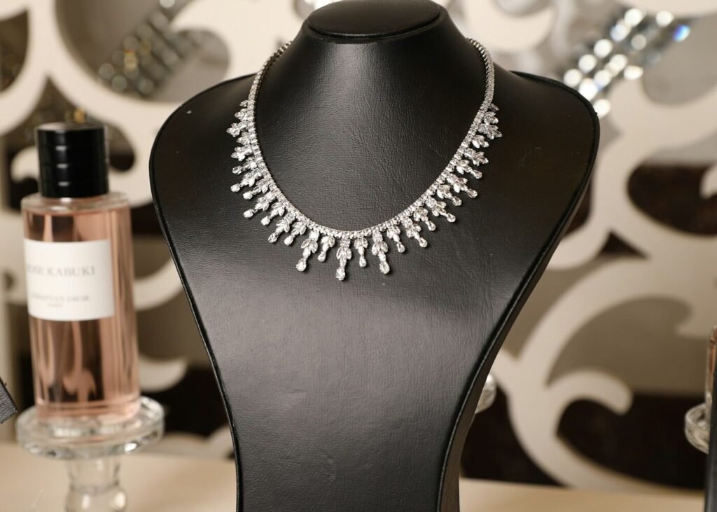 A diamond necklace displayed on a mannequin bust