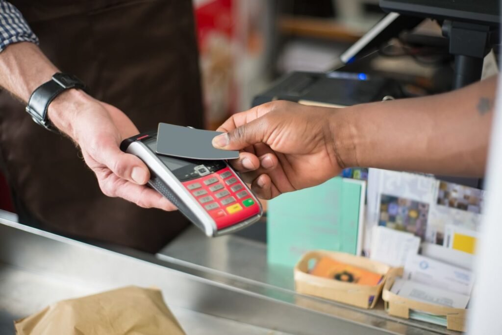 Shopper paying with a bank card on a mobile device