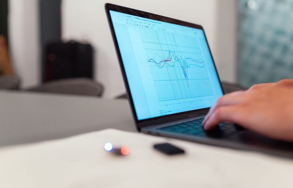Line chart on a laptop screen showing a cohort retention curve flattening over time