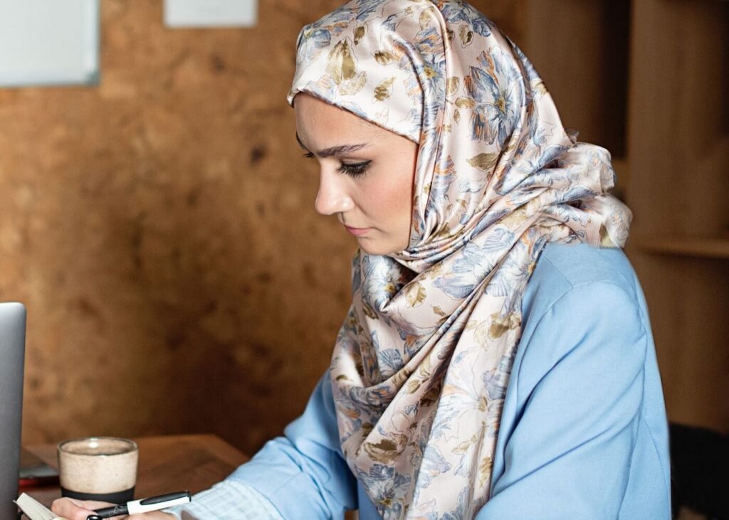 Content specialist preparing Arabic language product copy at a desk