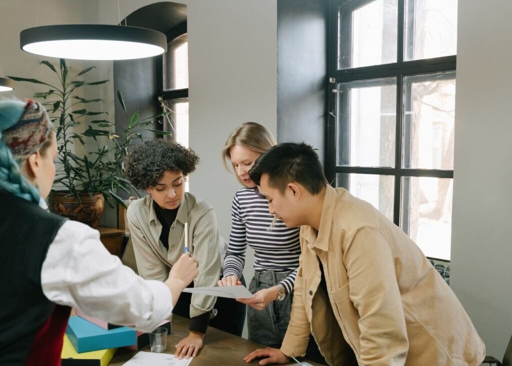 Colleagues discussing market strategy in an office