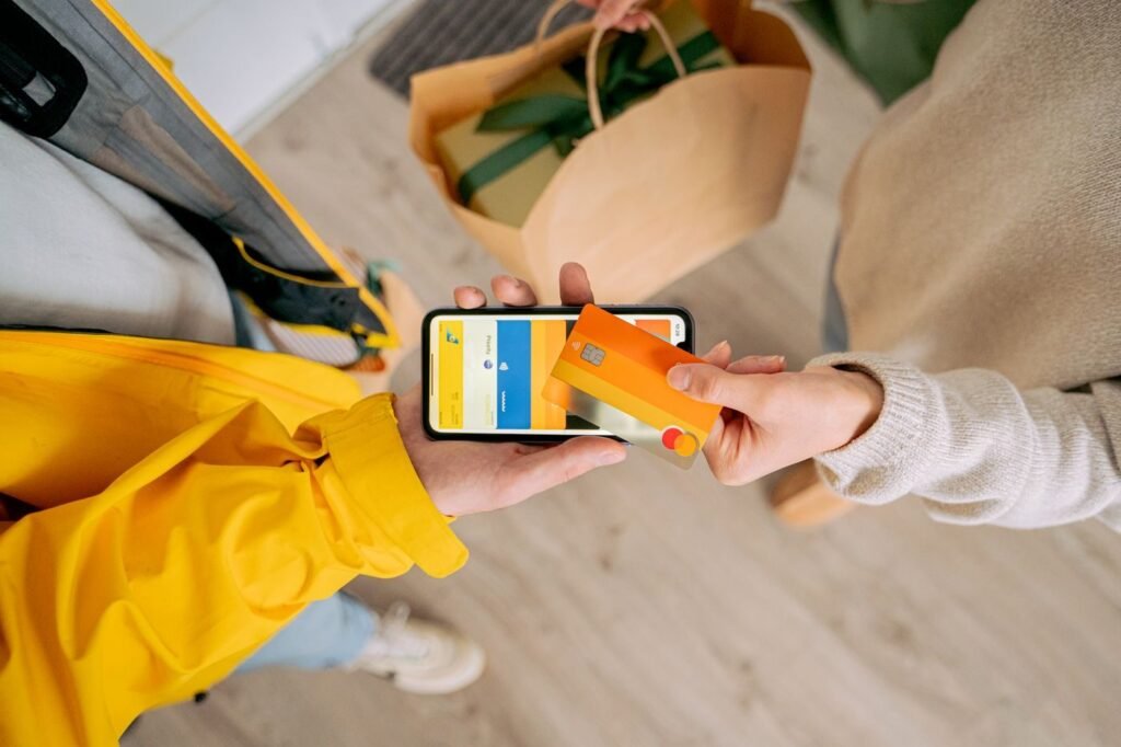 Customer paying by card for a delivery at the door