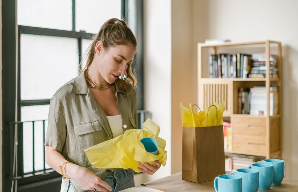 Seller preparing and photographing products for a marketplace listing