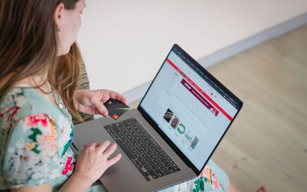 Shopper comparing product details on a laptop while browsing an online store