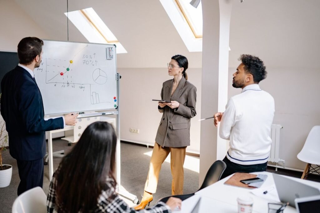 Team reviewing performance charts while presenting client results
