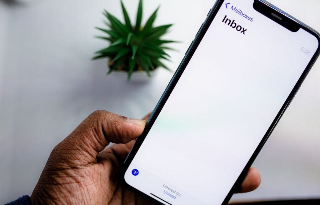 Close-up of a smartphone showing an email inbox, where lifecycle marketing actually lands