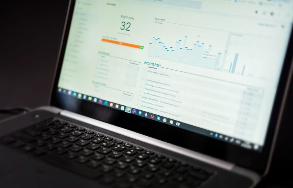 Laptop showing a cohort retention dashboard with repeat purchase data