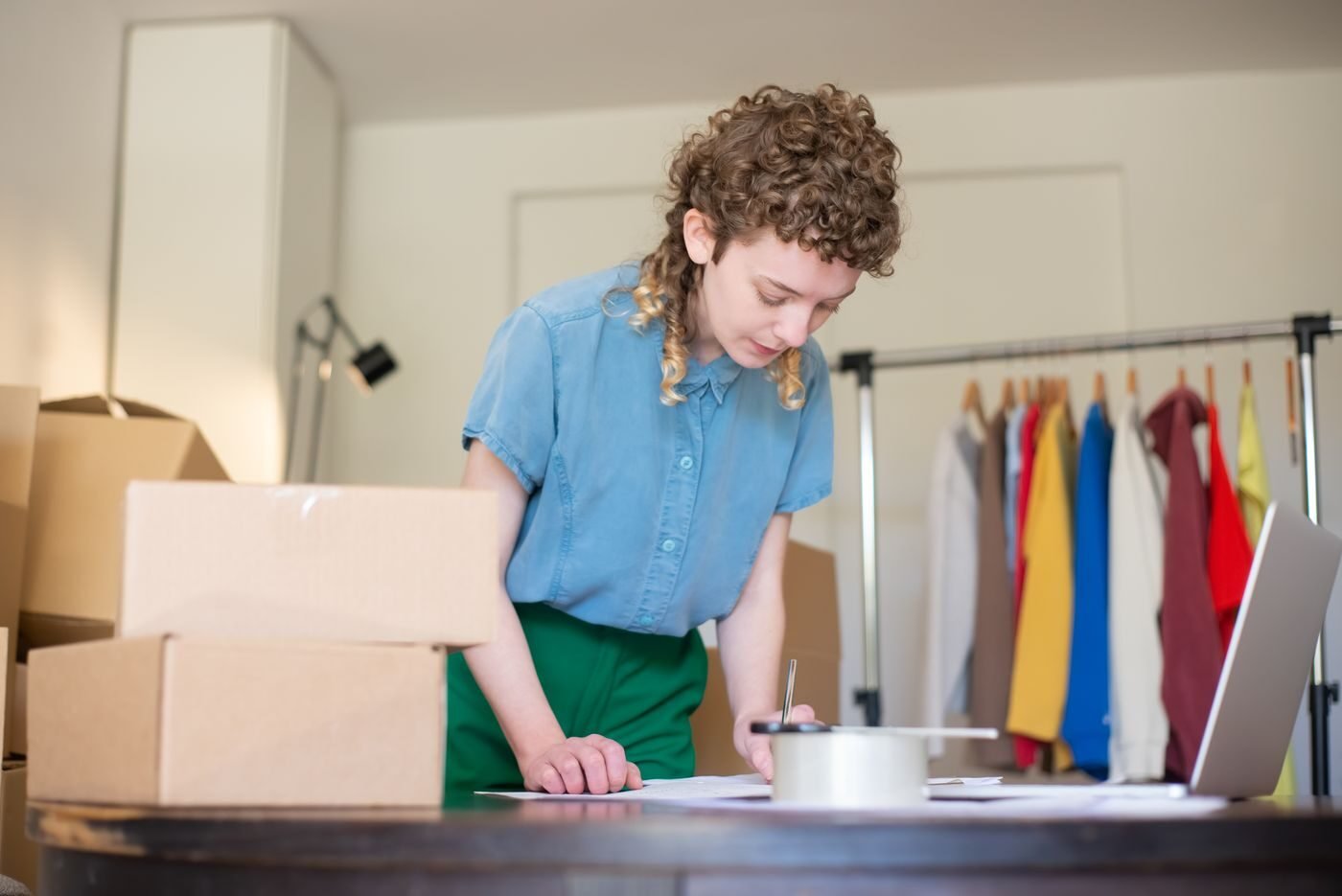 Seller packing online marketplace orders at home in Southeast Asia