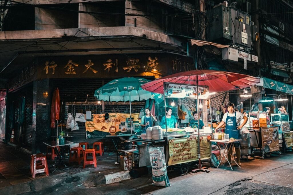 Busy night market street scene in Thailand