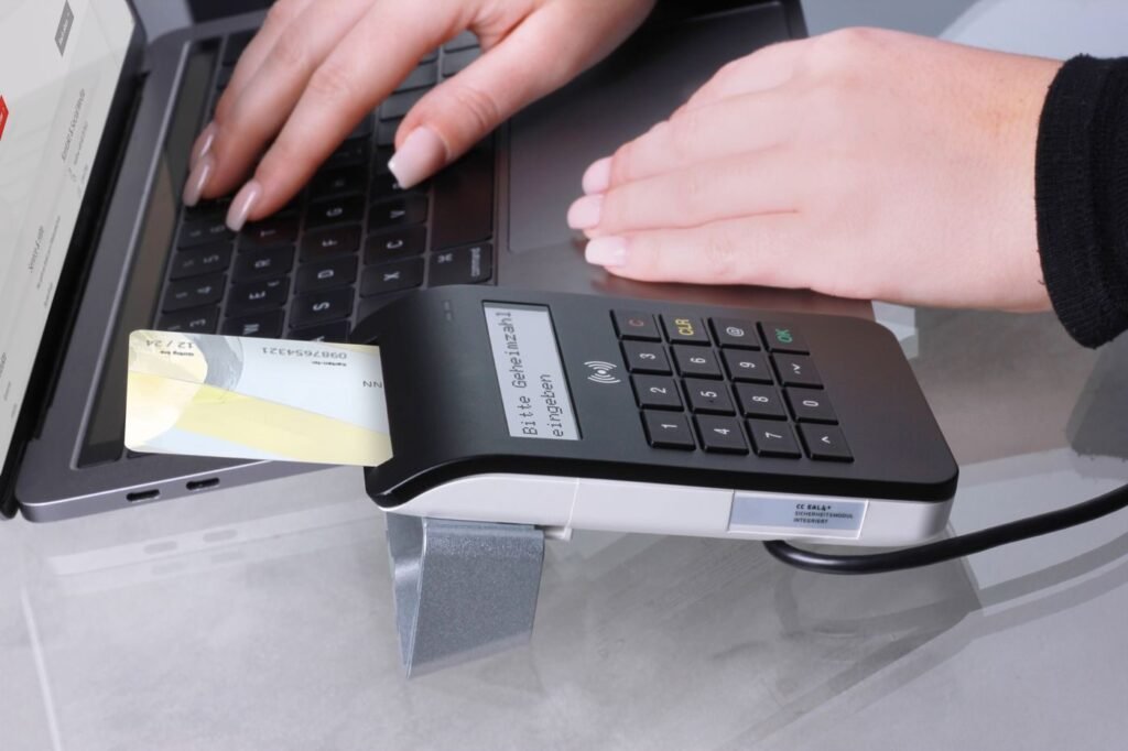 Payment card being used at a terminal in an office