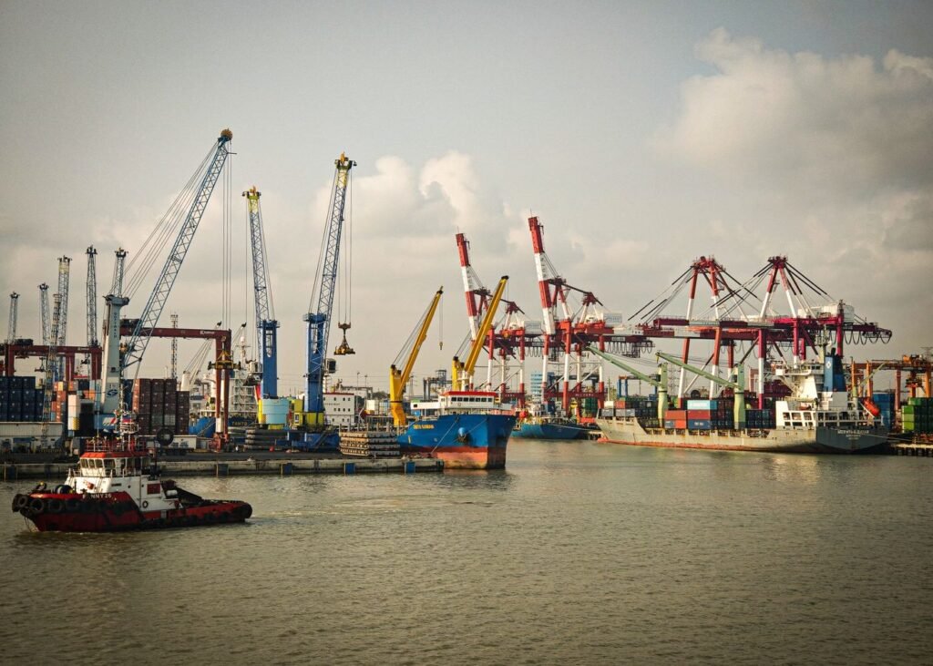 Industrial port in Indonesia with cargo ships and cranes