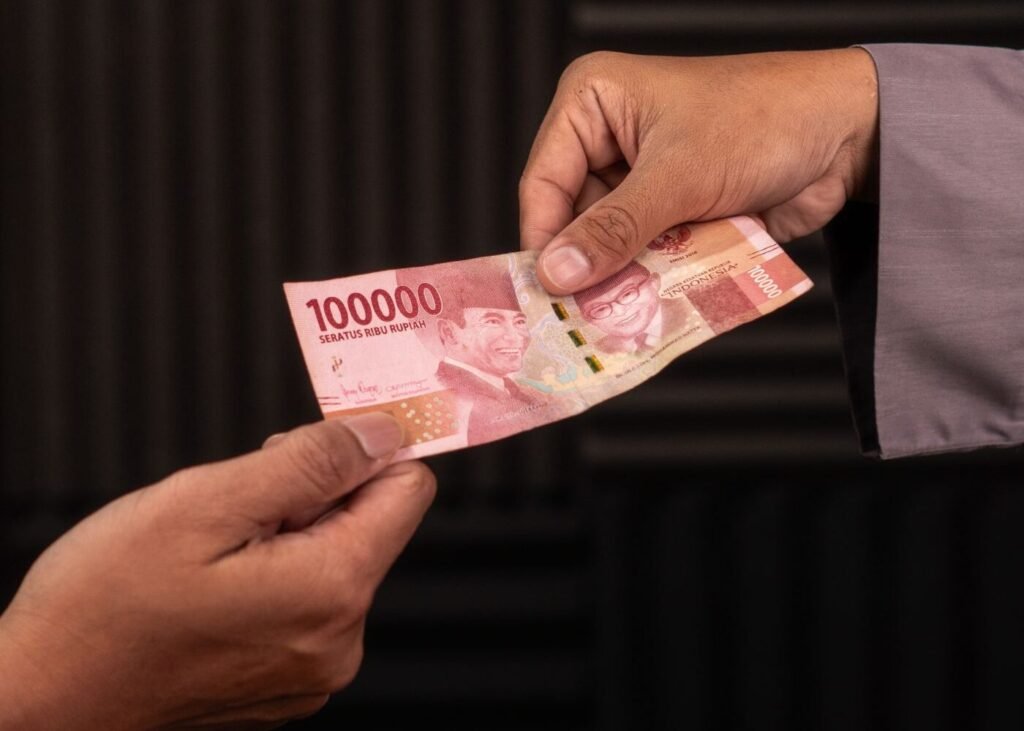 Local currency notes exchanged during a purchase in Southeast Asia
