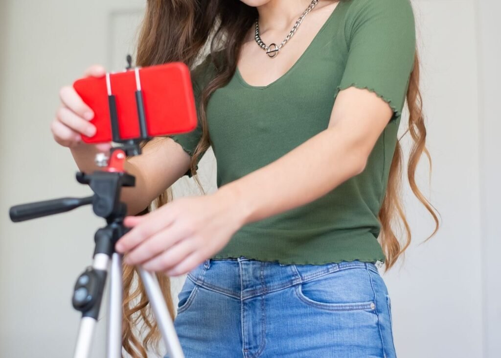 Seller setting up a smartphone on a tripod for a live selling session