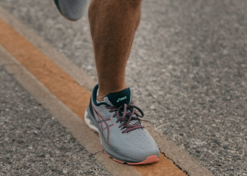 A runner mid-stride in training shoes