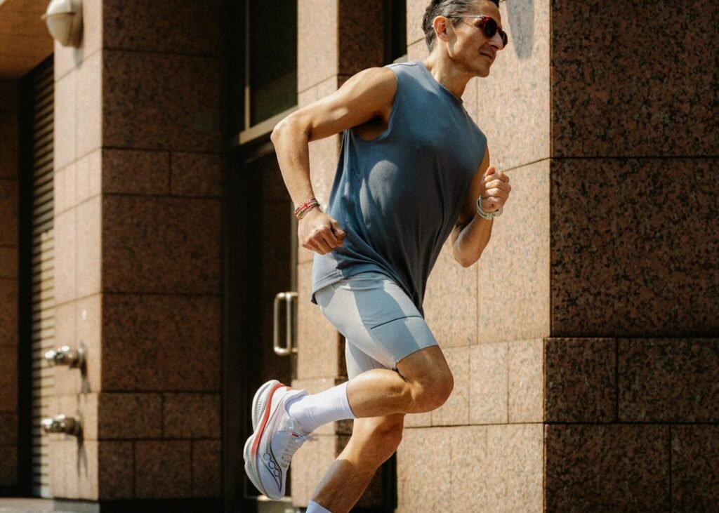 A runner training on a pavement in a city