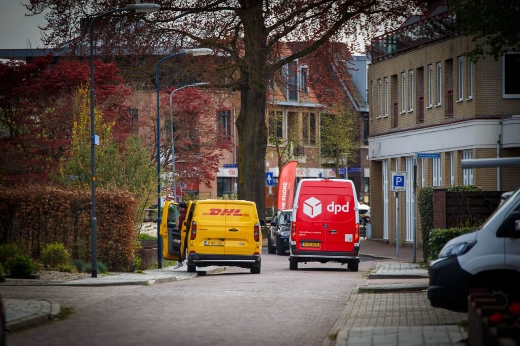 Delivery vans on a residential street in a European town