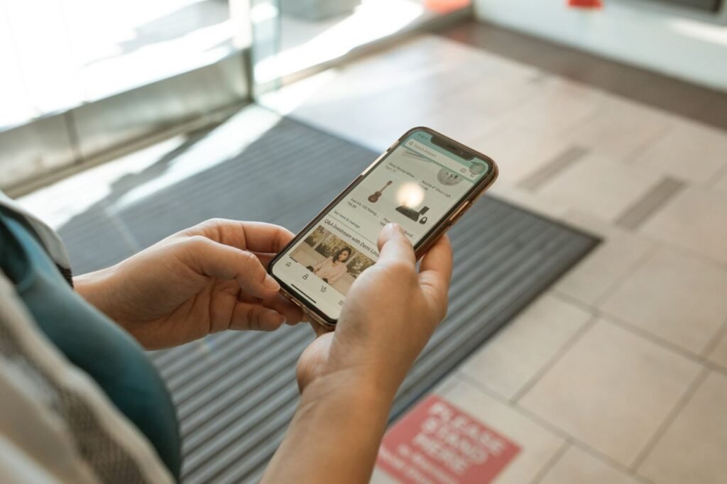 Close-up of a shopper using a phone to buy online