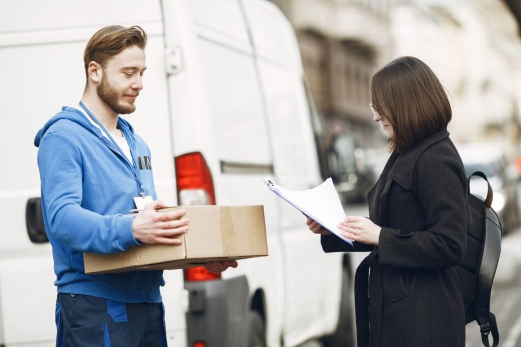 Courier handing a parcel to a customer at the door