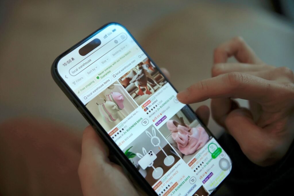 Close-up of a shopper completing an online purchase on a smartphone