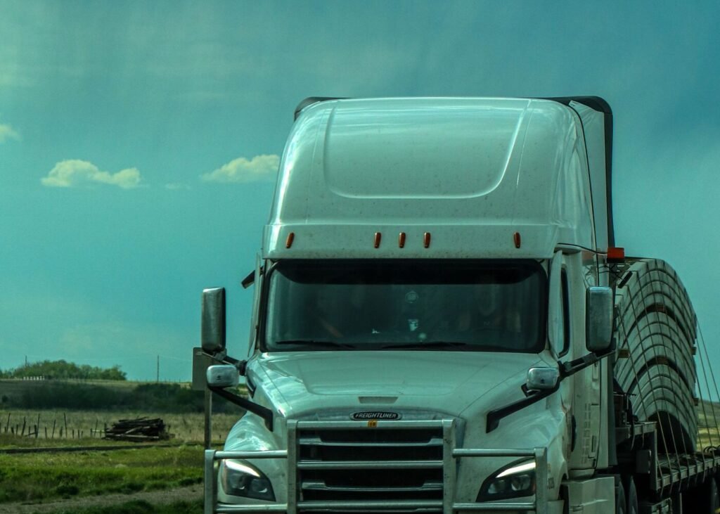 Freight truck travelling a United States highway under a dramatic sky
