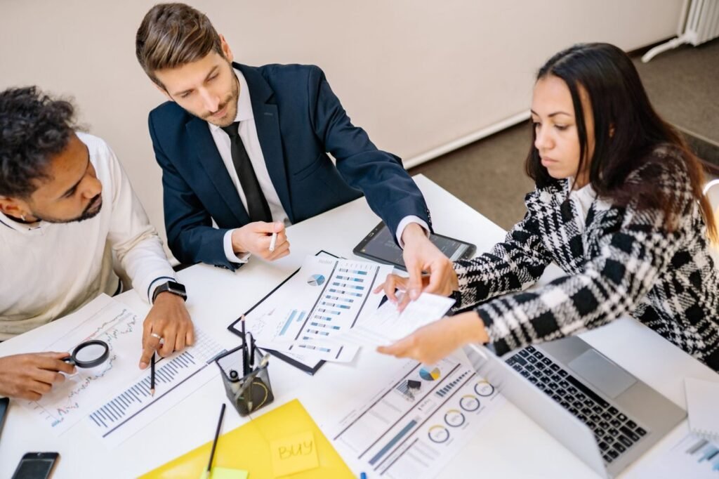 eCommerce strategists brainstorming a growth plan around a meeting table